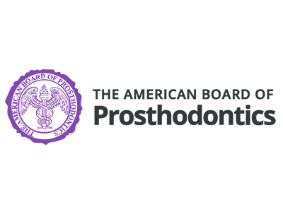 The logo of the American Board of Prosthodontics with a purple emblem and black text on a white background.