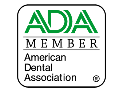 ADA Member logo for the American Dental Association, featuring green text and a black border on a white background.