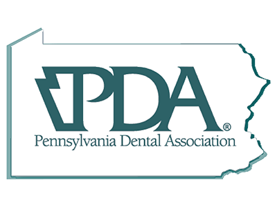 Logo of the Pennsylvania Dental Association with text inside an outline of the state of Pennsylvania.